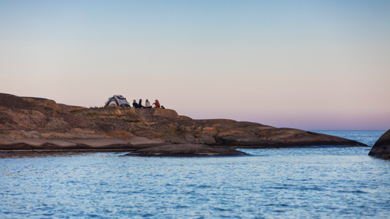 Smooth granite rocks and calm water in the Stockholm Archipelago during summer