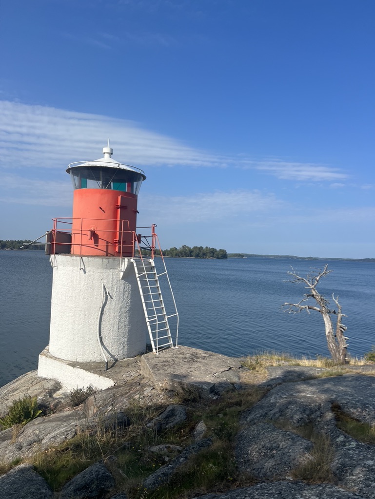 White and red lighthouse on Yxlan Island in the Stockholm Archipelago, Sweden.